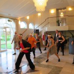 Alumni members performing a short Soran bushi for the ambassador and staff.